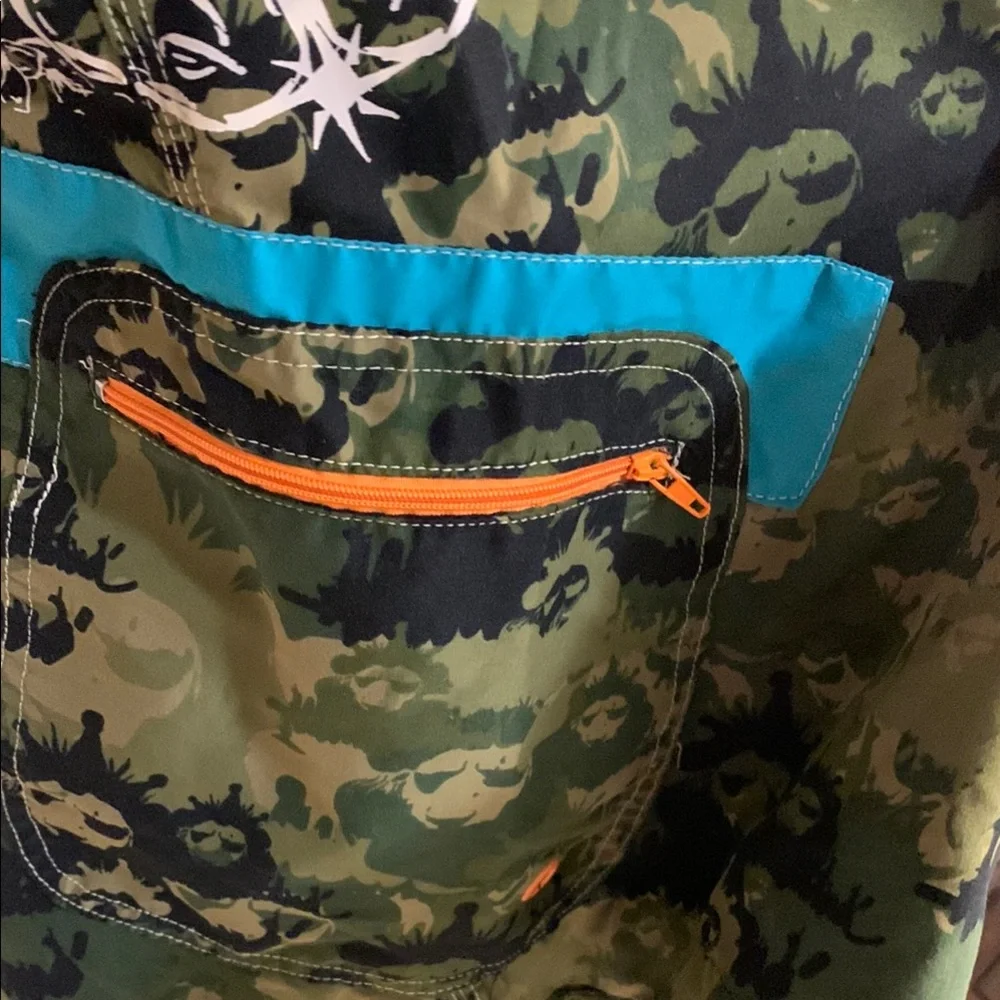 Live Mechanics Green/Blue Board Shorts with Drawstring Waist Camo Lion design.